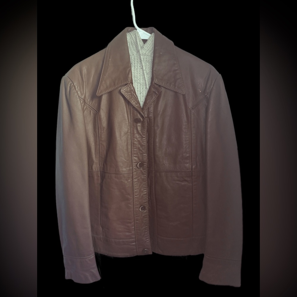 Medium light brown unisex leather jacket.